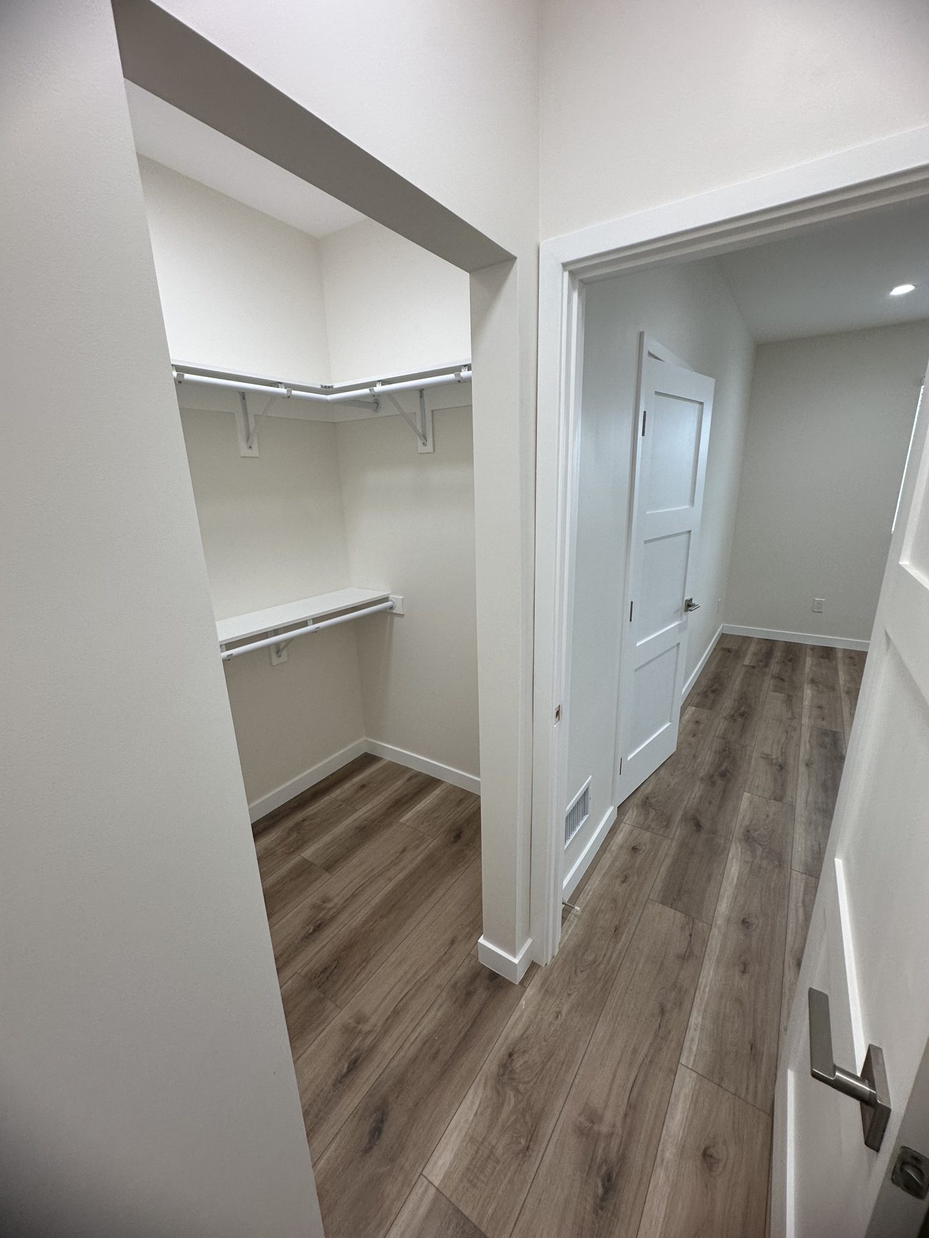 Walk-in closet with hanging rods and shelving at 1148 S Rimpau Blvd